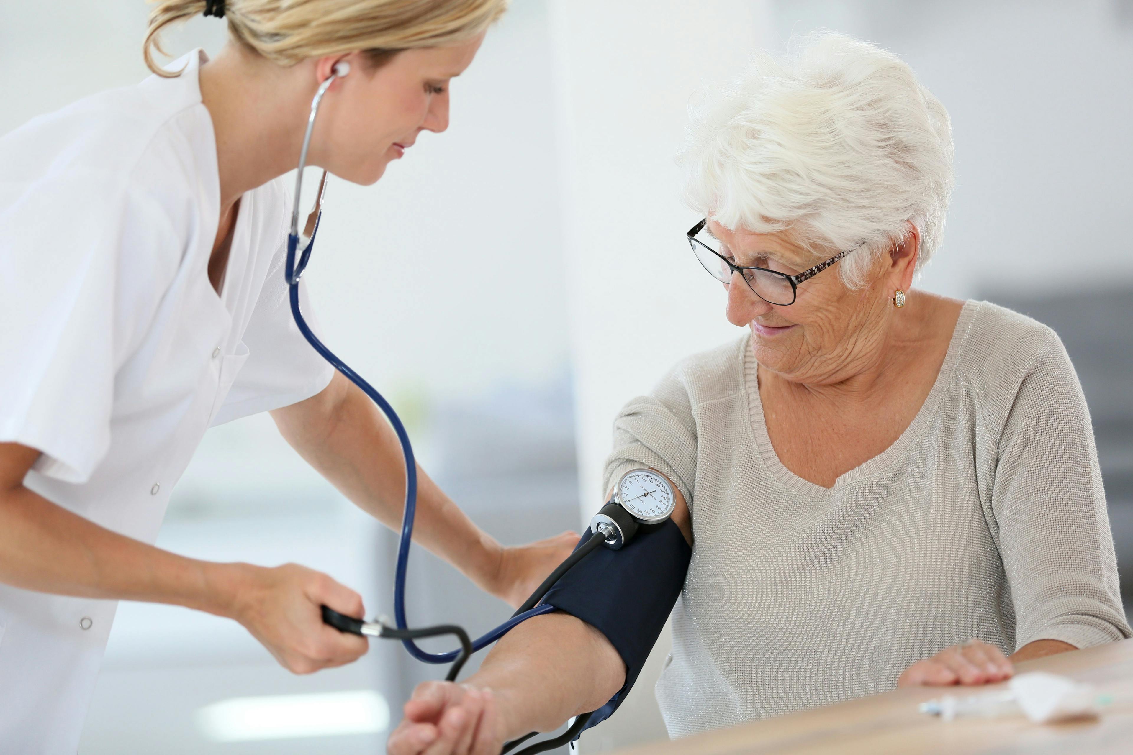 Older woman checking blood pressure