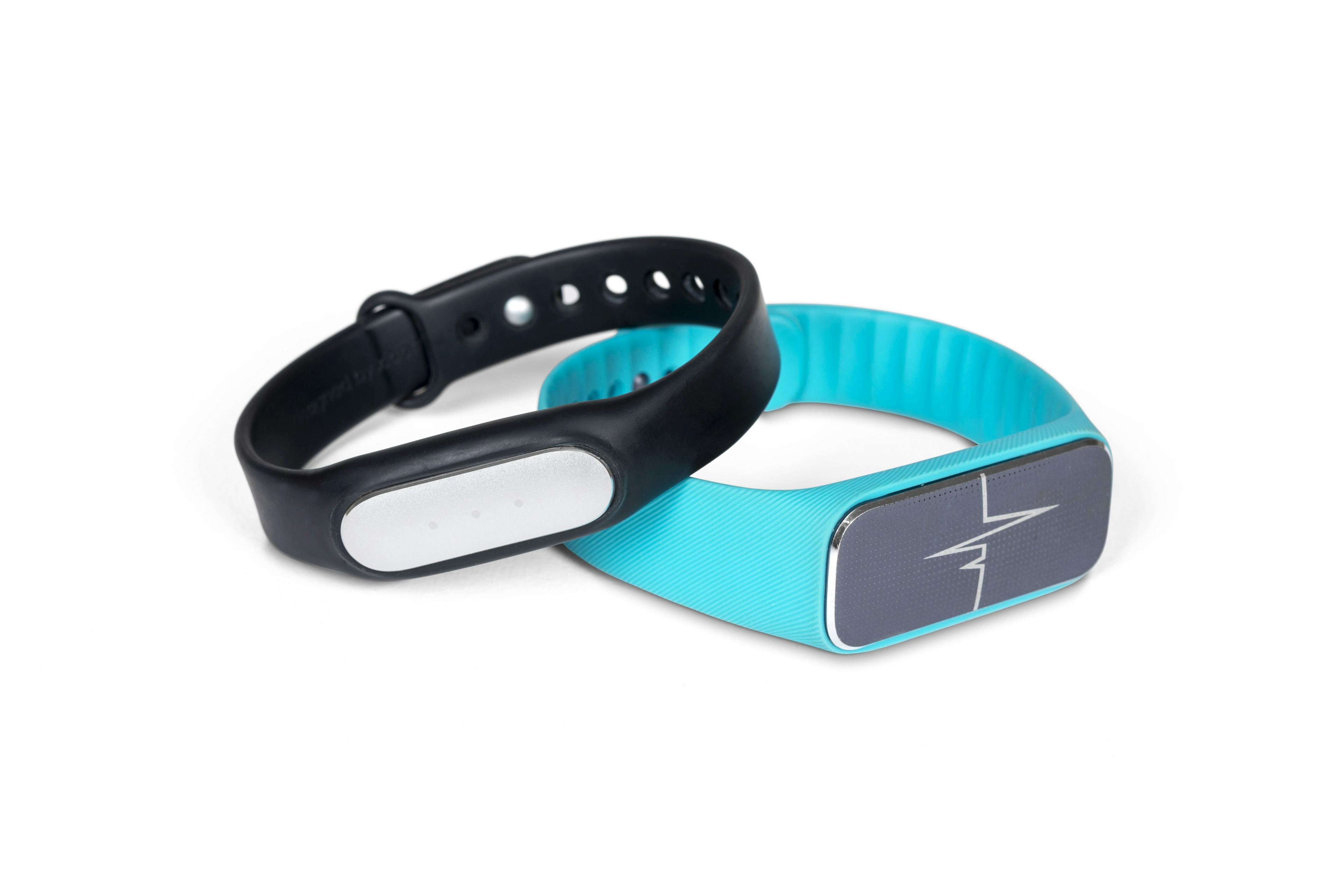 2 fitness trackers, one in blue and one in black
