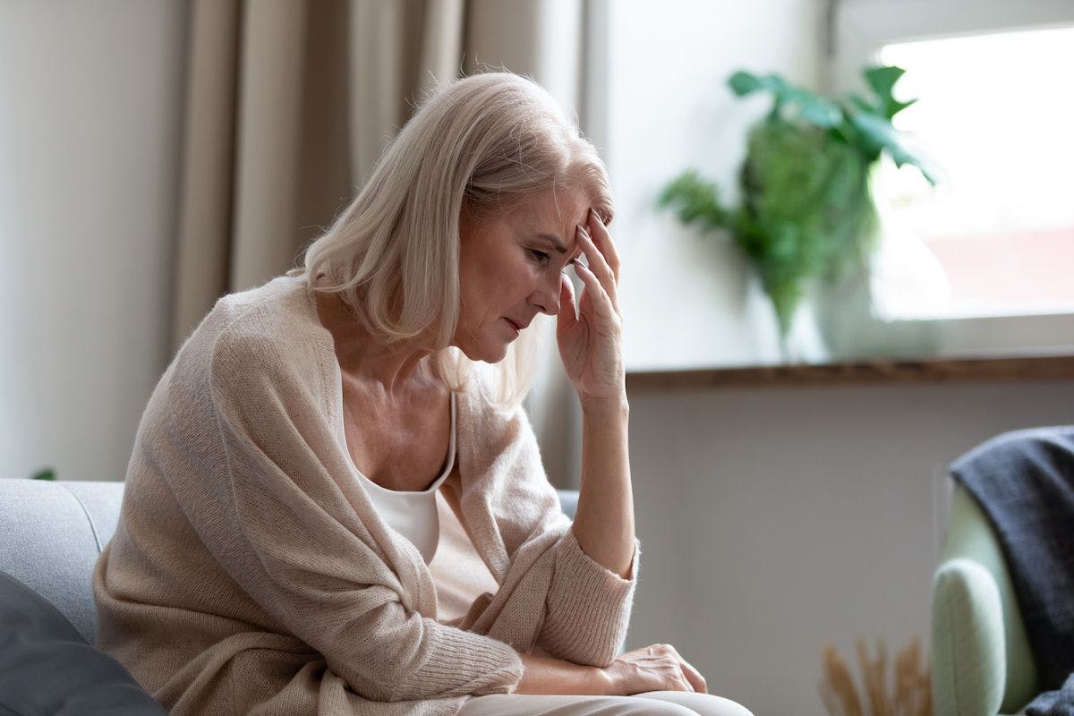 Older woman fatigue headache depression | Image Credit: © fizkes - stock.adobe.com