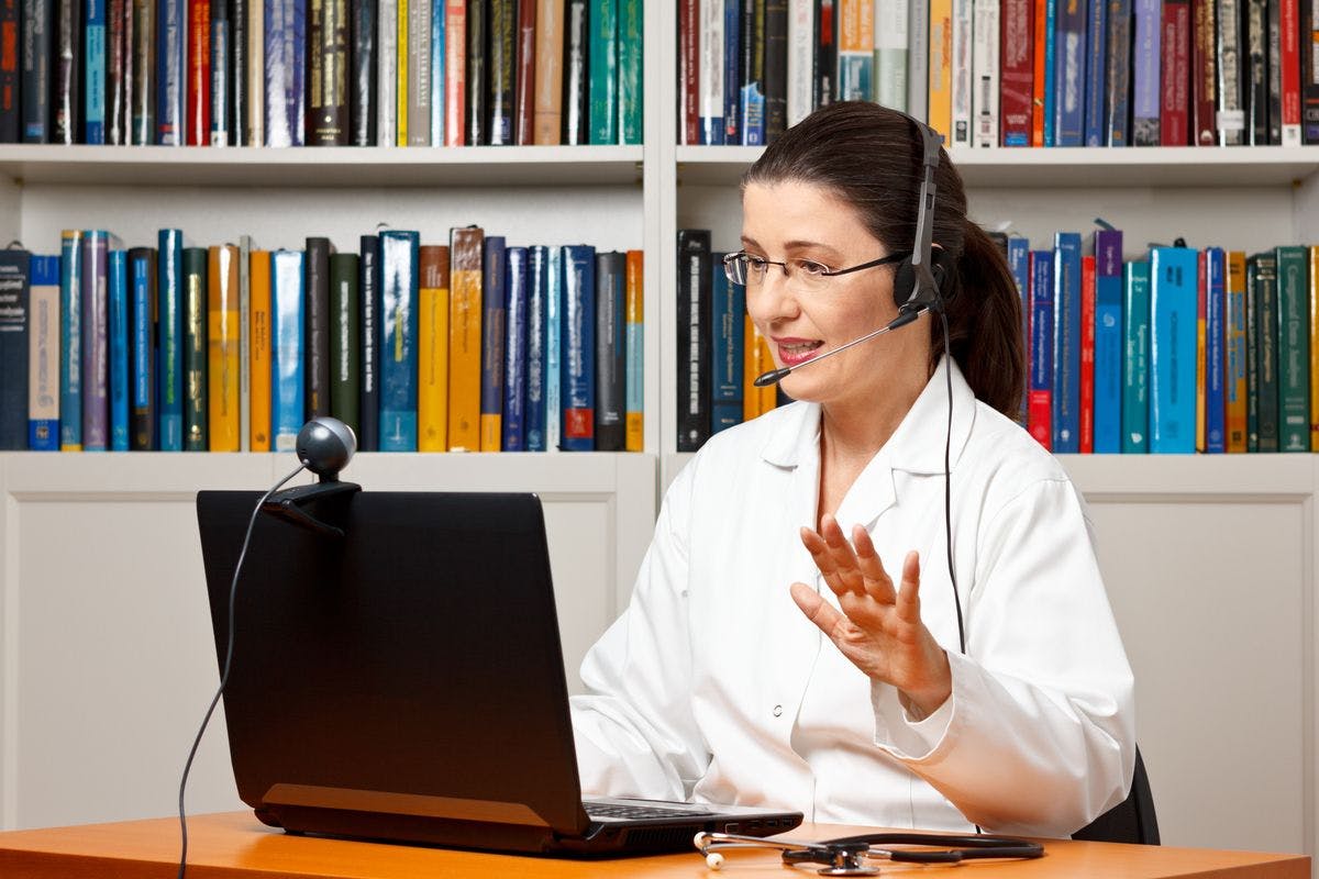 Physician consulting with a patient over the computer