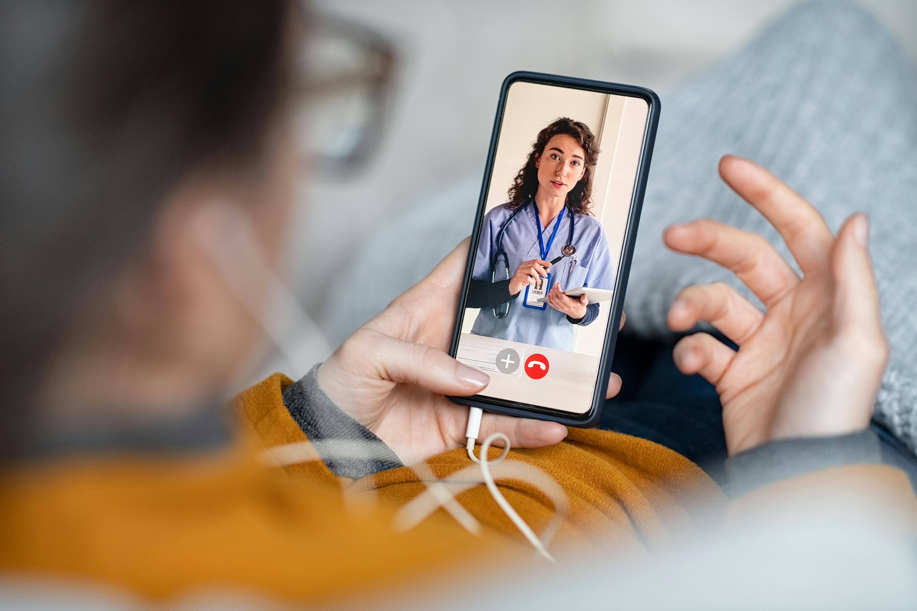 Woman doing video call with doctor | Rido - stock.adobe.com