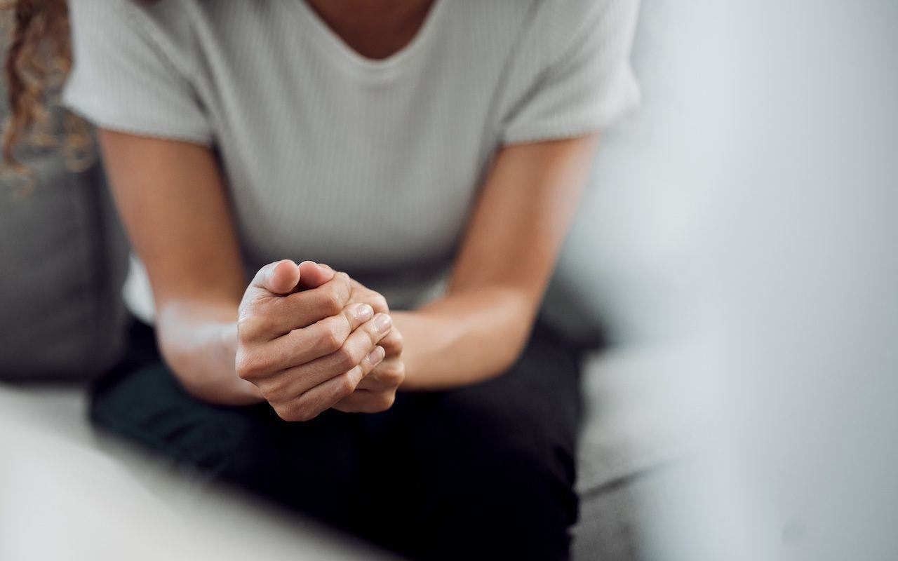 Psychology and mental health, a female patient feeling nervous in a clinic for support | Image credit: KApeopleimages - stock.adobe.com
