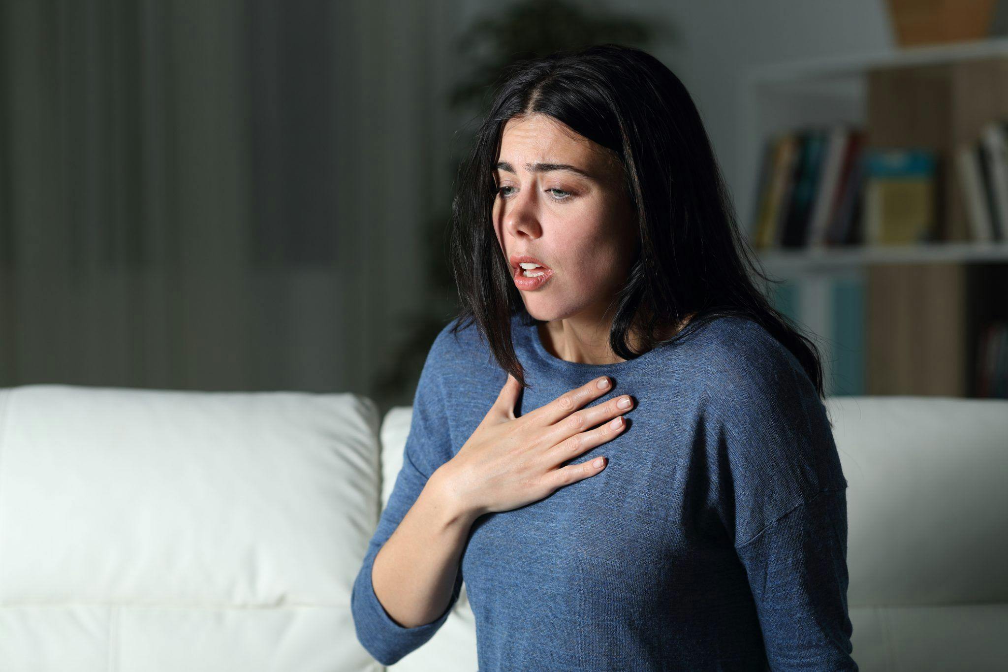 Woman Suffering an Anxiety Attack Alone in the Night Stock Photo | Image Credit iStockPhoto.com