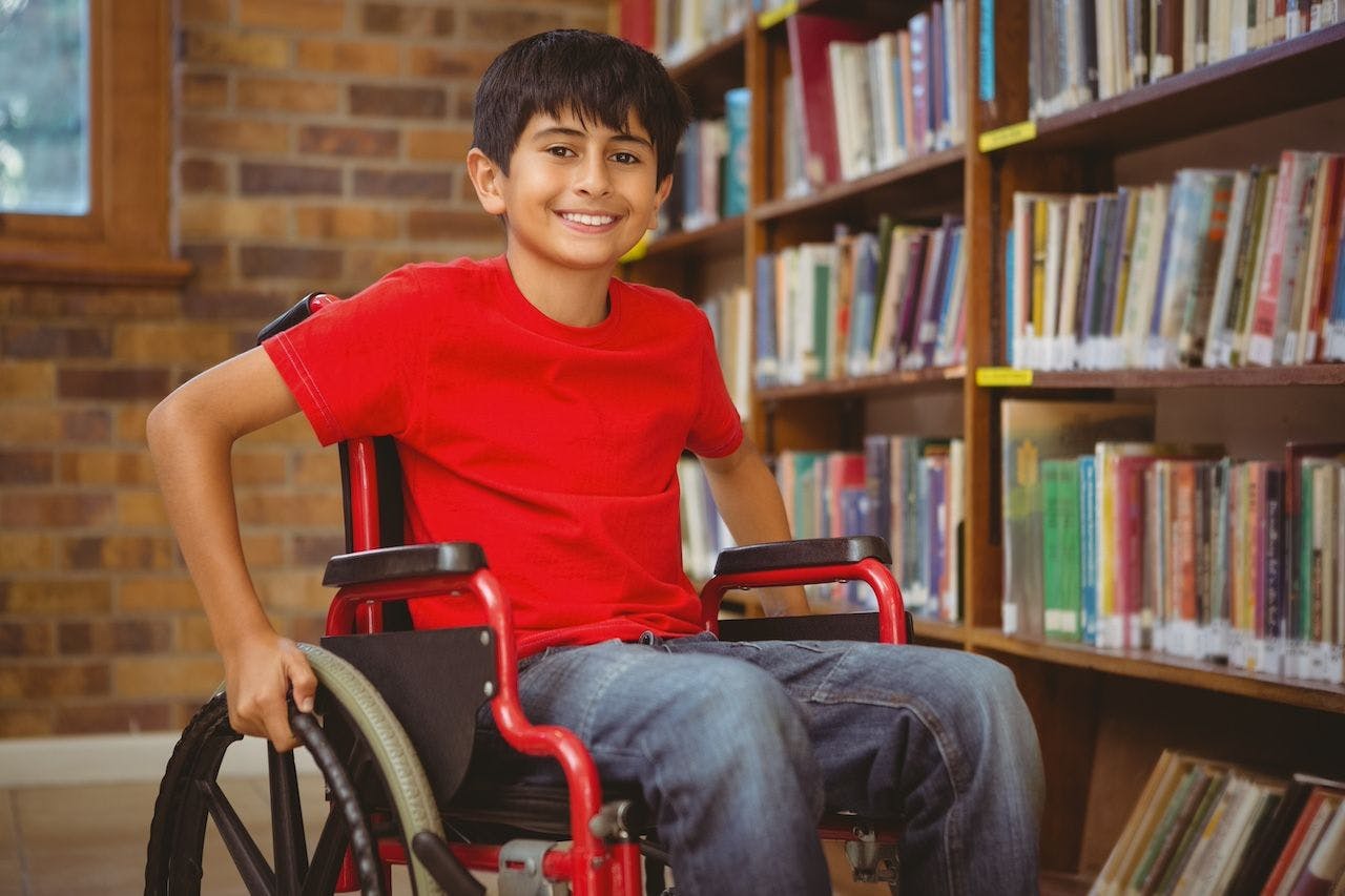 Portrait of boy sitting in wheelchair | Image Credit: WavebreakmediaMicro-stock.adobe.com