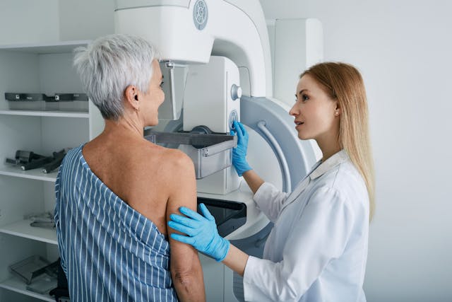 Older adult patient receiving mammogram | Image Credit: Peakstock - stock.adobe.com