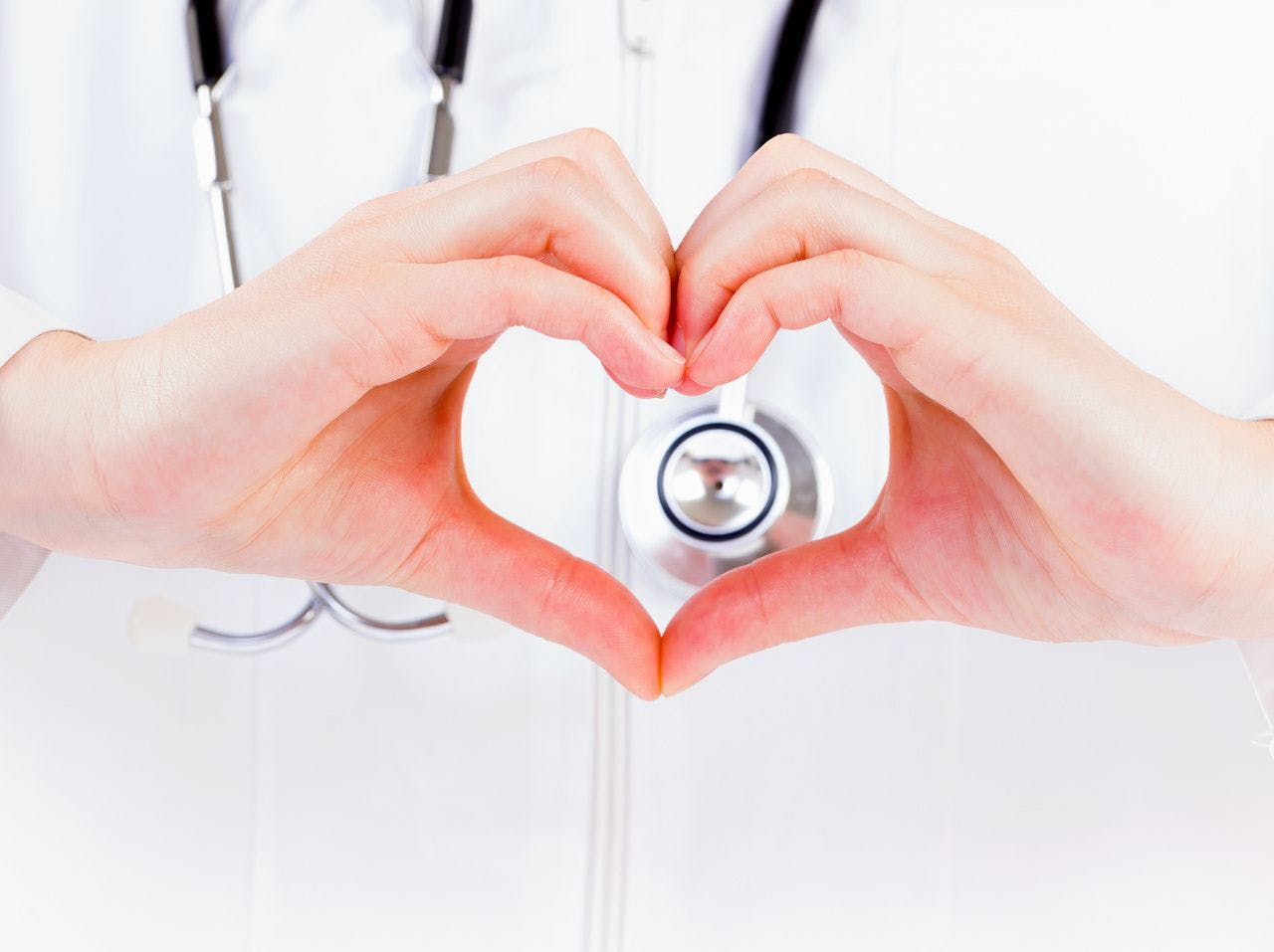 Image of physician making heart shape with hands.jpg