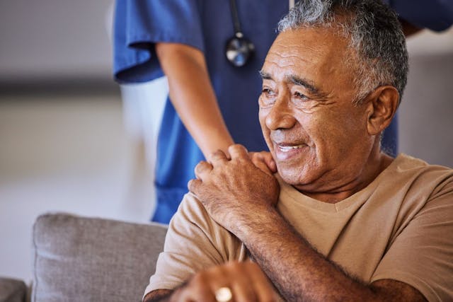 Older man smiling with nurse | Image Credit: © Beaunitta Van Wyk/peopleimages.com - stock.adobe.com