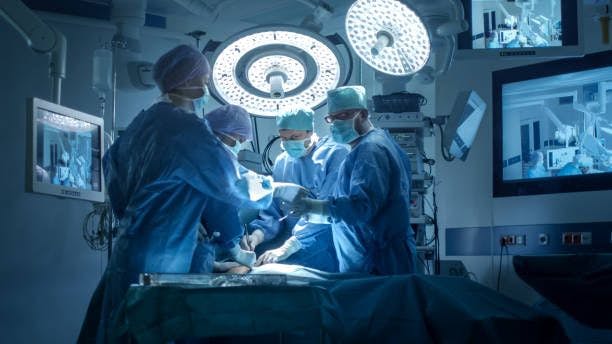 4 surgeons performing surgery