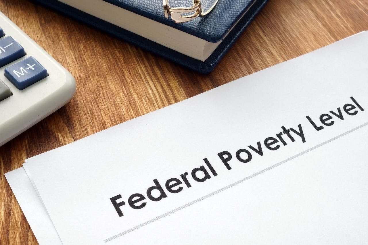 Federal Poverty Level FPL documents on a desk: © Vitalii Vodolazskyi - stock.adobe.com
