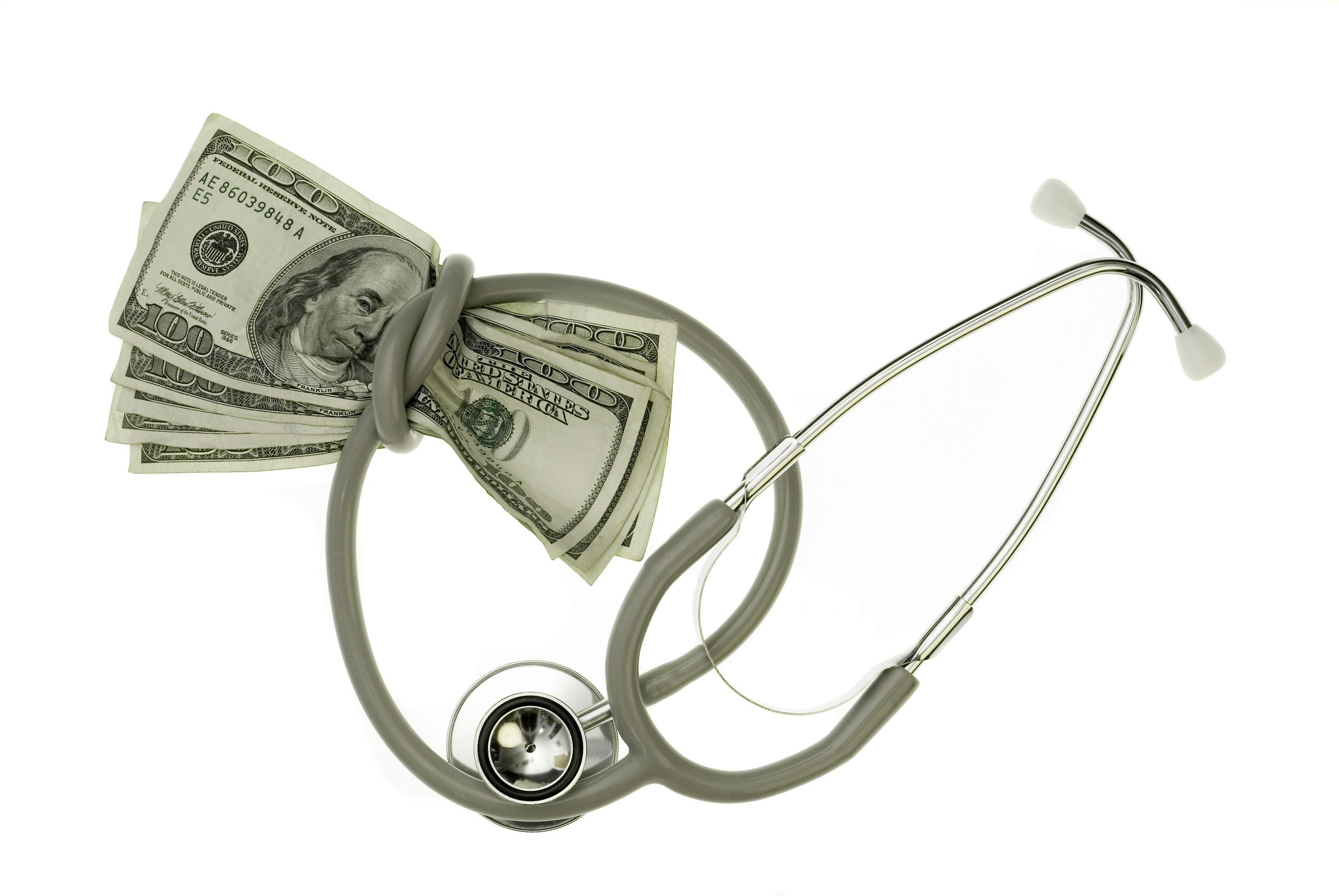Money wrapped by a stethoscope